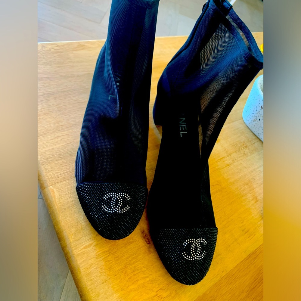 Gorgeous suede and mesh style ankle boots by Chanel. Never worn.
